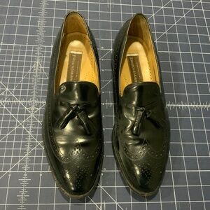 Johnston & Murphy black wing-tip tassel slip-ons